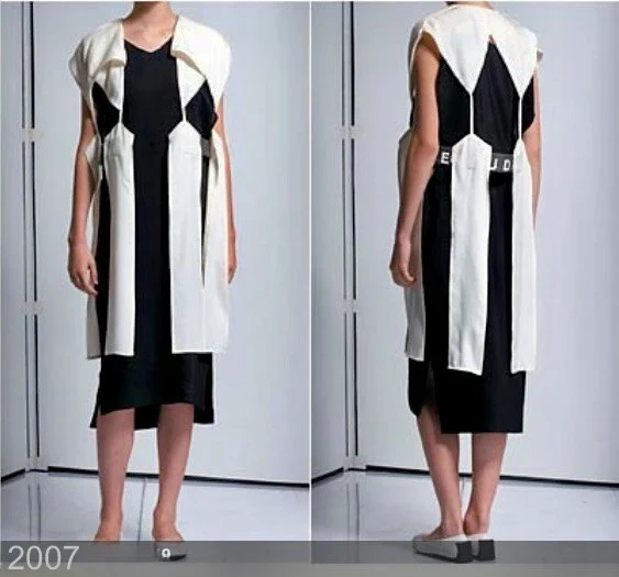 Front and rear views of a black and white cutout dress.