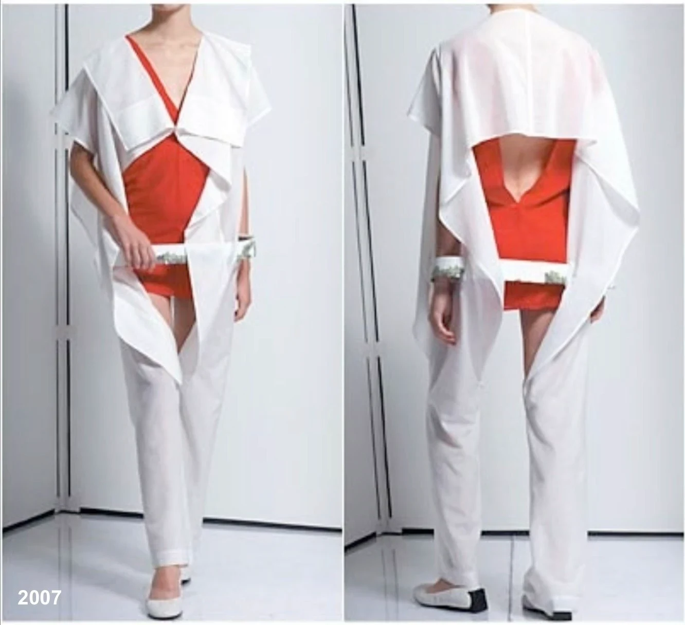 Front and rear views of a white garment with angular red inserts.