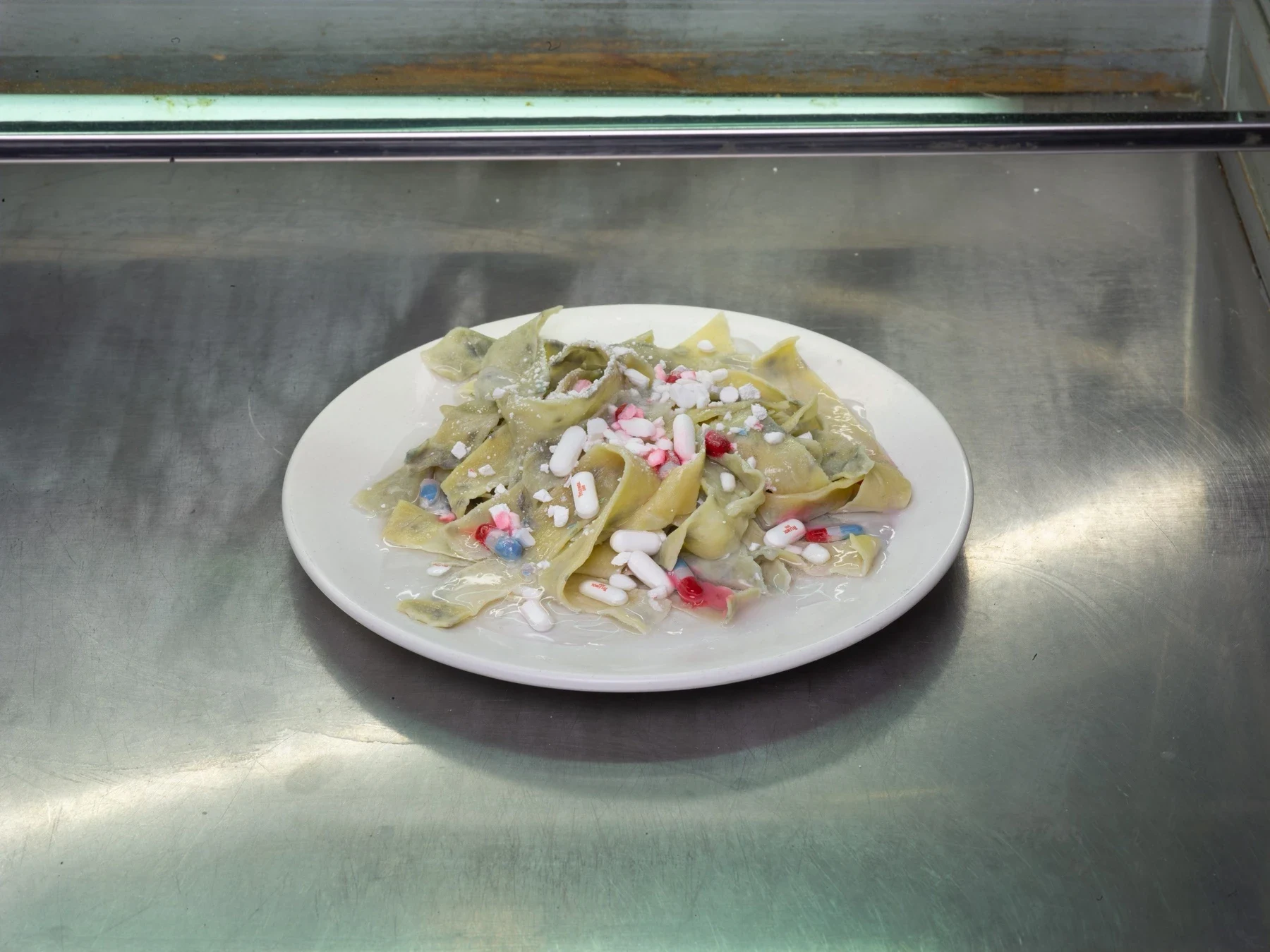 Small colorful objects arranged on a white plate.