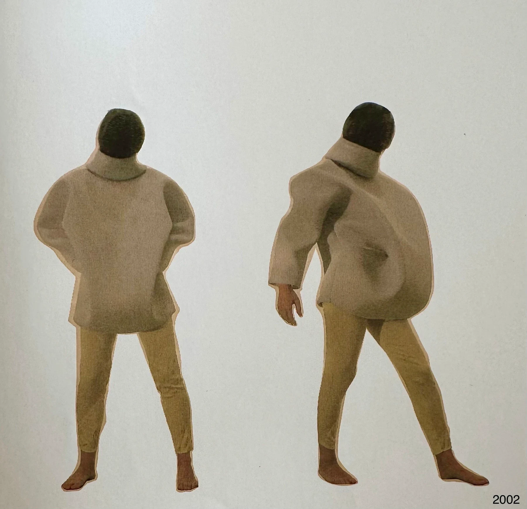 Two views of a person in a cream padded sculptural garment.