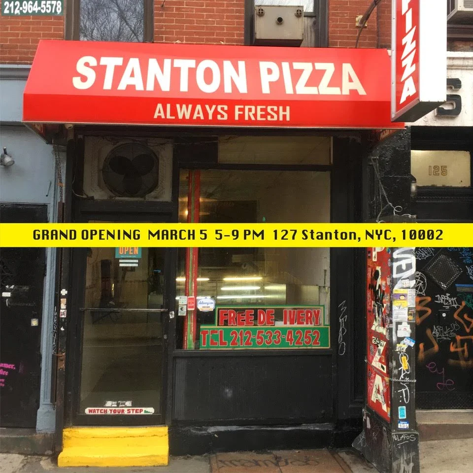 The Stanton Pizza storefront with its red sign.