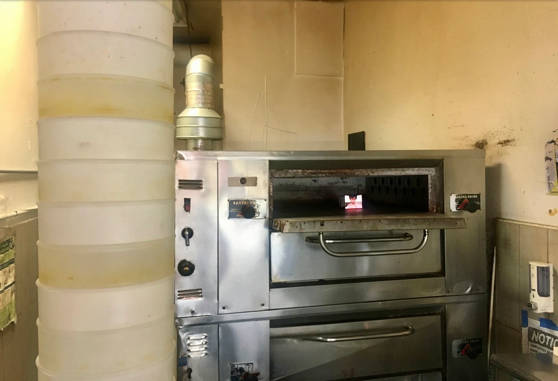An installation above and beside the pizza ovens.